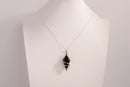 Black onyx spiral crystal pendant necklace with 925 sterling silver chain on white display bust