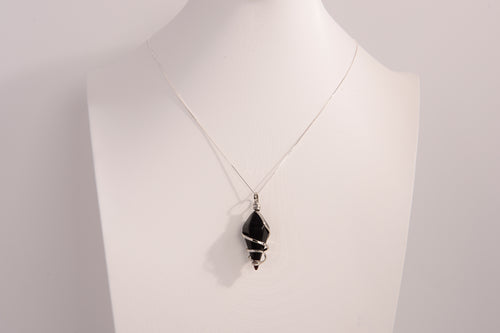 Black onyx spiral crystal pendant necklace with 925 sterling silver chain on white display bust
