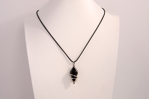 Black onyx spiral crystal pendant necklace on black cord chain displayed on white bust