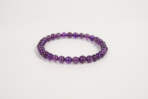 Amethyst beaded bracelet from Raw Earth Crystals, featuring natural gemstones for spiritual growth, intuition, and calming energy.