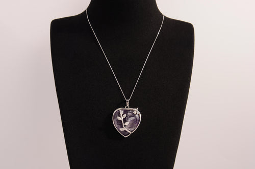 Raw Earth Crystals amethyst heart pendant with an elegant rose design, featuring a deep purple amethyst stone and a silver-tone vine with leaves, promoting spiritual growth, intuition, and inner peace.
