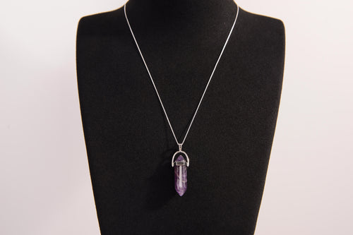 Raw Earth Crystals amethyst necklace with a pointed natural stone pendant, designed to enhance spiritual awareness, promote calmness, and support intuition.