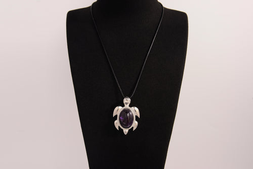 Raw Earth Crystals amethyst turtle necklace made from natural crystal to enhance spiritual awareness, calm the mind, and promote inner peace.