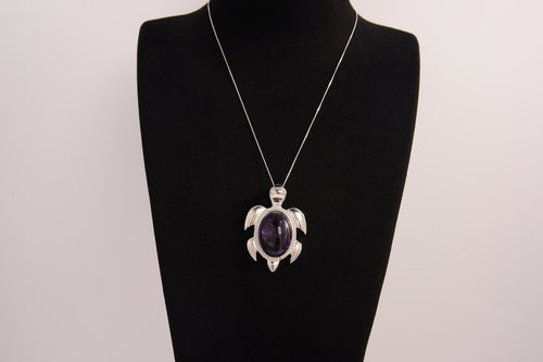 Raw Earth Crystals amethyst turtle necklace made from natural crystal to enhance spiritual awareness, calm the mind, and promote inner peace.