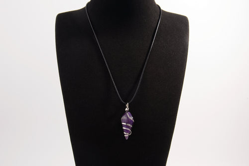 Raw Earth Crystals amethyst pendant with a spiral wire wrap design, crafted from natural stone to support spiritual growth, intuition, and inner peace.