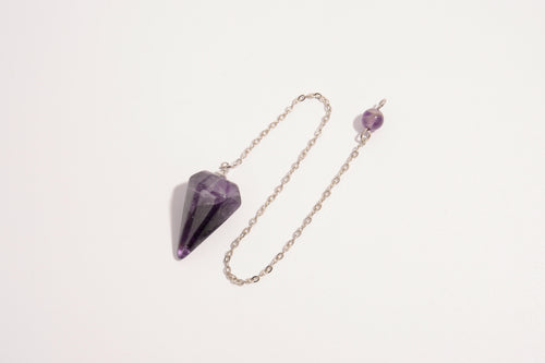 Raw Earth Crystals amethyst pendulum with pointed crystal and silver chain, crafted for intuition, spiritual growth, and inner peace.
