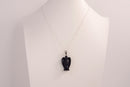 Raw Earth Crystals angel pendant crafted from blue sandstone, featuring a serene sculpted design to promote peace, protection, and spiritual connection.