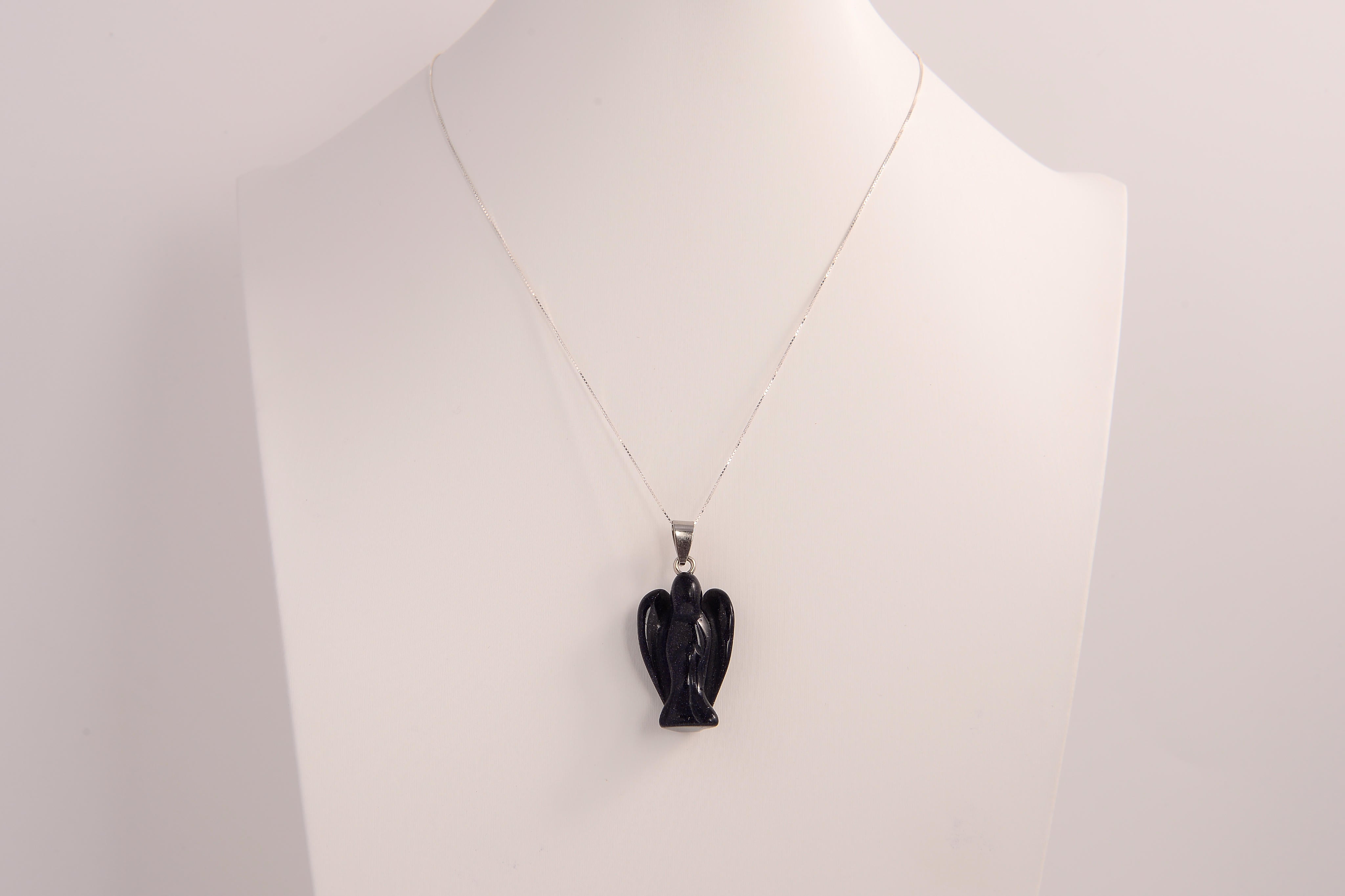 Raw Earth Crystals angel pendant crafted from blue sandstone, featuring a serene sculpted design to promote peace, protection, and spiritual connection.