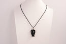 Raw Earth Crystals angel pendant crafted from carved obsidian, featuring a sleek, polished design to promote protection, grounding, and spiritual clarity.