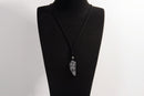 Raw Earth Crystals black labradorite point pendant necklace featuring natural crystal jewelry designed for intuition, spiritual insight, and inner strength.