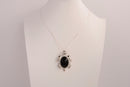 Raw Earth Crystals black obsidian turtle necklace made from natural crystal to offer grounding, protection, and emotional stability.