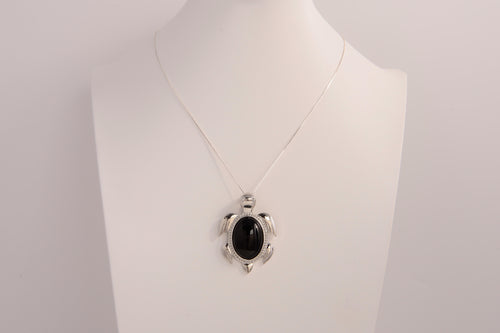 Raw Earth Crystals black obsidian turtle necklace made from natural crystal to offer grounding, protection, and emotional stability.