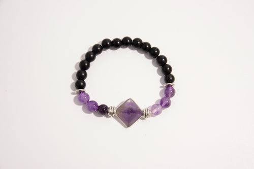 Raw Earth Crystals black onyx and amethyst bracelet with silver accent, crafted from natural crystals, promotes spiritual awareness, calmness, and emotional balance.