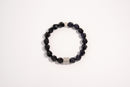 Raw Earth Crystals black onyx and blue goldstone faceted bracelet with silver accent, crafted from natural crystals, promotes protection, confidence, and inner strength.