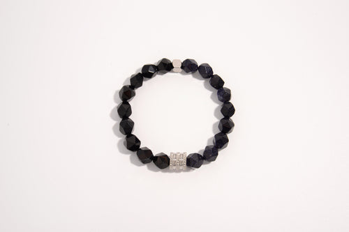 Raw Earth Crystals black onyx and blue goldstone faceted bracelet with silver accent, crafted from natural crystals, promotes protection, confidence, and inner strength.
