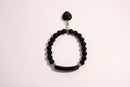 Raw Earth Crystals black onyx bracelet with raw stone accent, made from natural crystal, supports protection, grounding, and emotional stability.