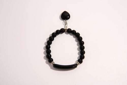 Raw Earth Crystals black onyx bracelet with raw stone accent, made from natural crystal, supports protection, grounding, and emotional stability.