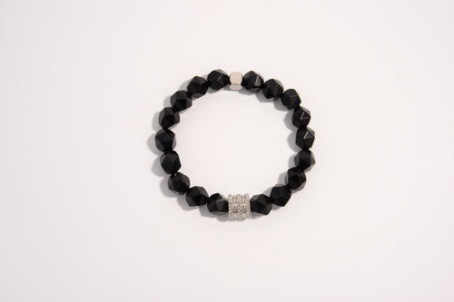 Raw Earth Crystals black onyx faceted bracelet with silver accent, crafted from natural crystal, promotes strength, protection, and emotional balance.