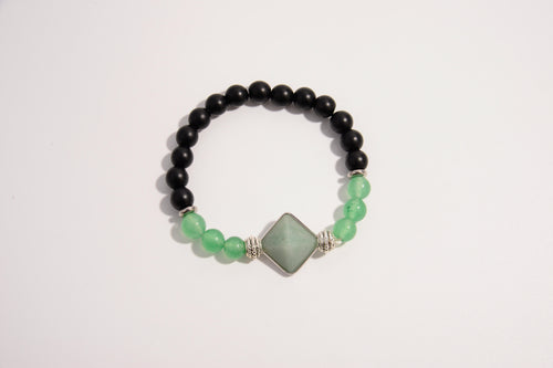 Raw Earth Crystals black onyx and green aventurine bracelet with silver accent, crafted from natural crystals, promotes balance, prosperity, and emotional harmony.