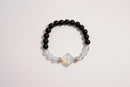 Raw Earth Crystals black onyx and opal bracelet with silver accent, crafted from natural crystals, promotes grounding, emotional balance, and inner peace.