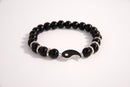 Raw Earth Crystals black tourmaline bracelet with yin yang design, made from natural crystal, supports balance, protection, and spiritual harmony.