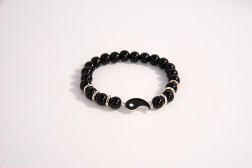 Raw Earth Crystals black tourmaline bracelet with yin yang design, made from natural crystal, supports balance, protection, and spiritual harmony.
