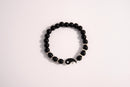 Raw Earth Crystals black tourmaline bracelet with yin yang design, crafted from natural crystal, promotes balance, protection, and inner clarity.