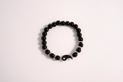 Raw Earth Crystals black tourmaline bracelet with yin yang design, crafted from natural crystal, promotes balance, protection, and inner clarity.