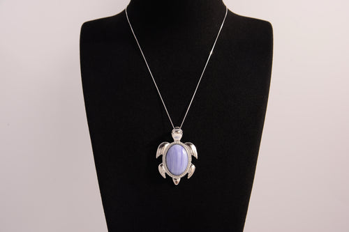 Raw Earth Crystals blue agate turtle necklace made from natural crystal to promote peace, emotional balance, and soothing energy.