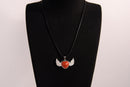 Raw Earth Crystals carnelian heart with wings necklace, featuring a vibrant orange-red heart-shaped stone adorned with delicate angelic wings, designed to boost energy, enhance motivation, and support emotional strength.