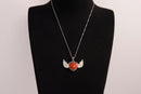 Raw Earth Crystals carnelian heart with wings necklace, featuring a vibrant orange-red heart-shaped stone adorned with delicate angelic wings, designed to boost energy, enhance motivation, and support emotional strength.