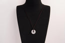 Raw Earth Crystals clear quartz disc pendant necklace featuring a natural crystal for balance, clarity, and spiritual protection.