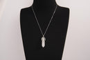 Raw Earth Crystals clear quartz necklace with a pointed natural stone pendant, designed to enhance clarity, amplify energy, and support spiritual awareness.