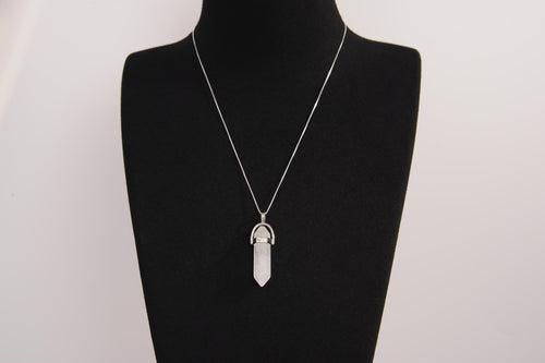 Raw Earth Crystals clear quartz necklace with a pointed natural stone pendant, designed to enhance clarity, amplify energy, and support spiritual awareness.