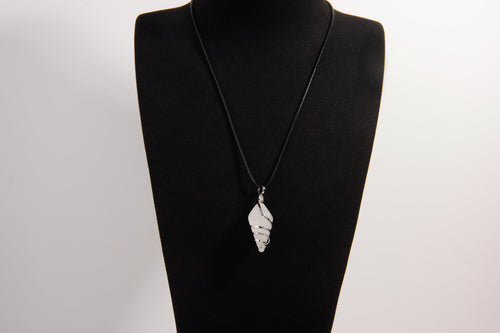 Raw Earth Crystals clear quartz pendant with a spiral wire wrap design, crafted from natural stone to enhance clarity, focus, and spiritual energy.