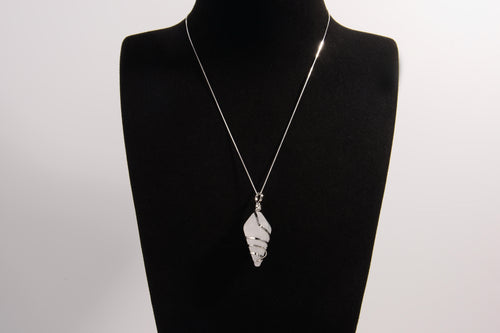 Raw Earth Crystals clear quartz pendant with a spiral wire wrap design, crafted from natural stone to enhance clarity, focus, and spiritual energy.