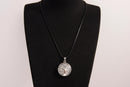 Raw Earth Crystals clear quartz pendant featuring a tree of life design, crafted with natural crystal for clarity, energy amplification, and balance.