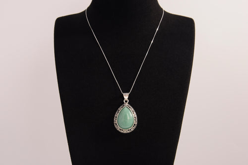 Raw Earth Crystals green aventurine pendant with a teardrop-shaped design, featuring natural green aventurine and an ornate silver-tone setting, promoting prosperity, luck, and emotional balance.