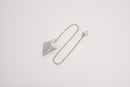 Raw Earth Crystals howlite pendulum with pointed crystal and silver chain, designed for emotional balance, patience, and mental clarity.