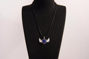 Raw Earth Crystals lapis lazuli heart with wings necklace, featuring a deep blue heart-shaped stone adorned with delicate angelic wings, designed to enhance wisdom, promote self-expression, and support spiritual insight.