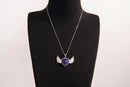 Raw Earth Crystals lapis lazuli heart with wings necklace, featuring a deep blue heart-shaped stone adorned with delicate angelic wings, designed to enhance wisdom, promote self-expression, and support spiritual insight.