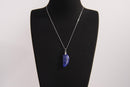 Raw Earth Crystals lapis lazuli pendant featuring an etched design, crafted from natural stone to promote truth, inner wisdom, and spiritual connection.
