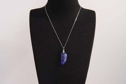 Raw Earth Crystals lapis lazuli pendant featuring an etched design, crafted from natural stone to promote truth, inner wisdom, and spiritual connection.