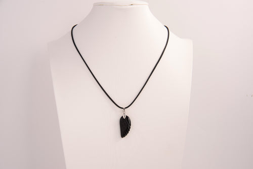 Raw Earth Crystals obsidian angel wing pendant, featuring a polished black obsidian stone carved into an elegant wing shape and set on a silver-tone chain, promoting protection, grounding, and spiritual connection.