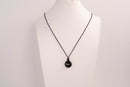 Raw Earth Crystals obsidian disc pendant necklace crafted from natural crystal for protection, grounding, and spiritual clarity.