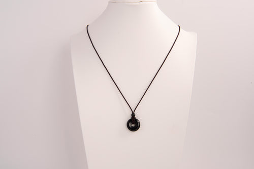 Raw Earth Crystals obsidian disc pendant necklace crafted from natural crystal for protection, grounding, and spiritual clarity.