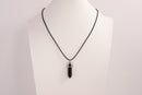 Raw Earth Crystals obsidian necklace with a pointed natural stone pendant, designed to offer protection, grounding, and emotional clarity.