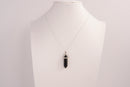 Raw Earth Crystals obsidian necklace with a pointed natural stone pendant, designed to offer protection, grounding, and emotional clarity.