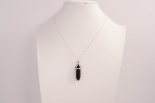 Raw Earth Crystals obsidian necklace with a pointed natural stone pendant, designed to offer protection, grounding, and emotional clarity.