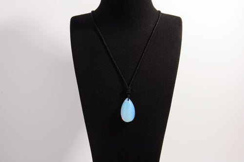 Raw Earth Crystals opal teardrop pendant on black cord, made from natural opal stone, enhancing intuition, emotional healing, and inner clarity.